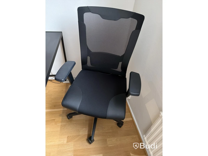 Black desk with office chair and lamp