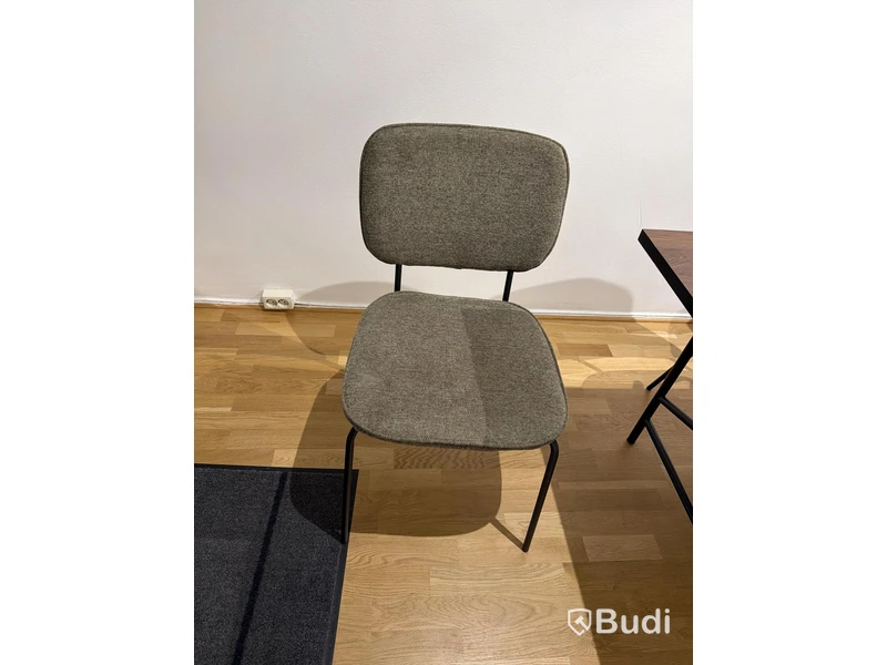 Dark wood table and 6 chairs with textile upholstery