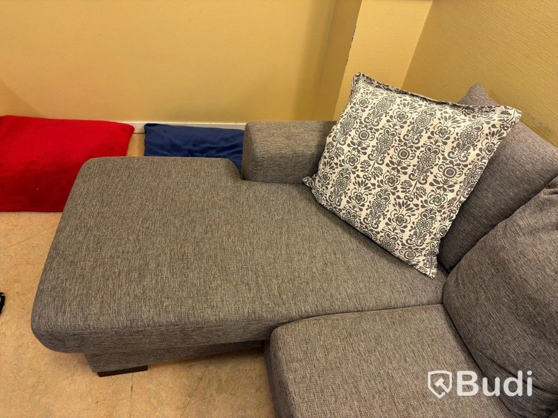 Sofa with chaise sections, coffee table and armchair