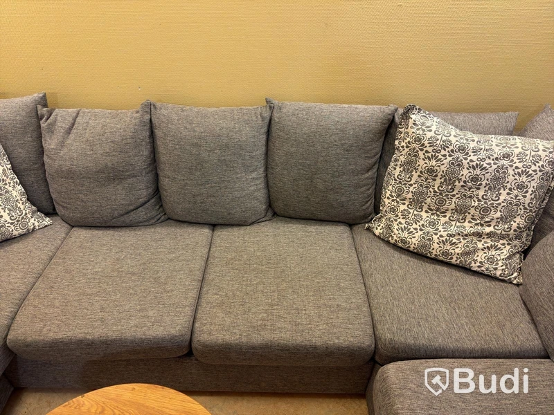 Sofa with chaise sections, coffee table and armchair