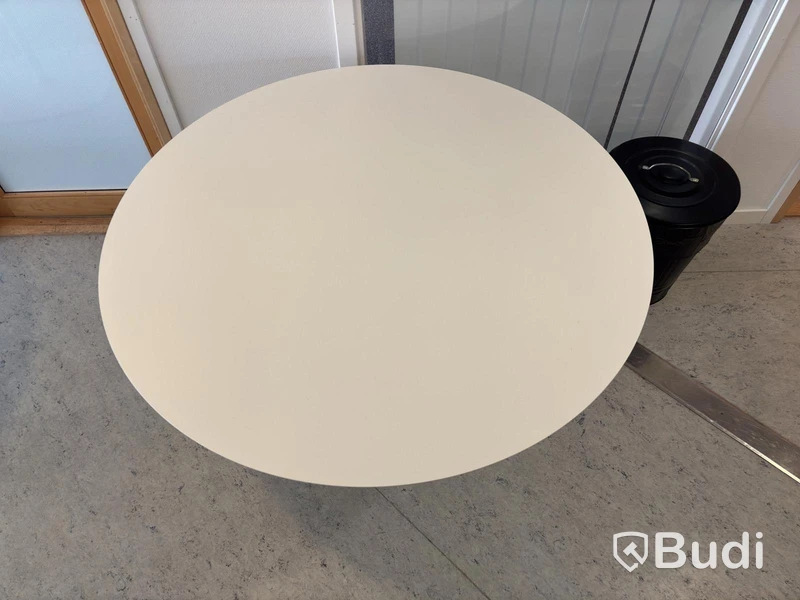 2 white round tables
