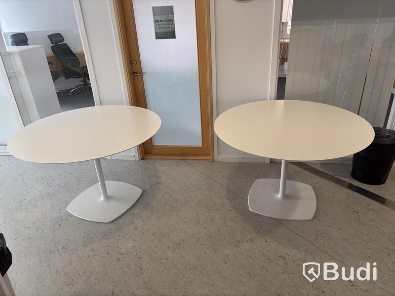 2 white round tables