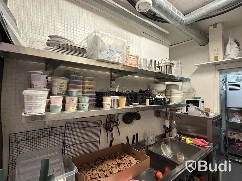 Kitchen equipment and storage items on shelving