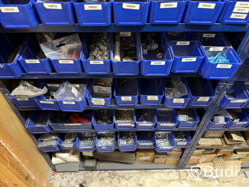 Storage shelving units with a large quantity of assorted bolts, nuts, etc.