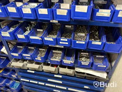 Storage shelving units with a large quantity of assorted bolts, nuts, etc.
