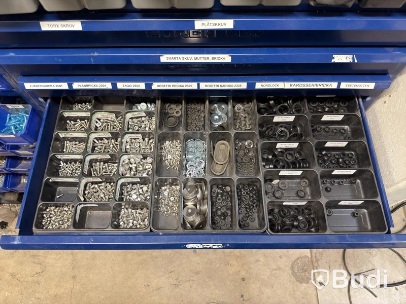 Storage shelving units with a large quantity of assorted bolts, nuts, etc.