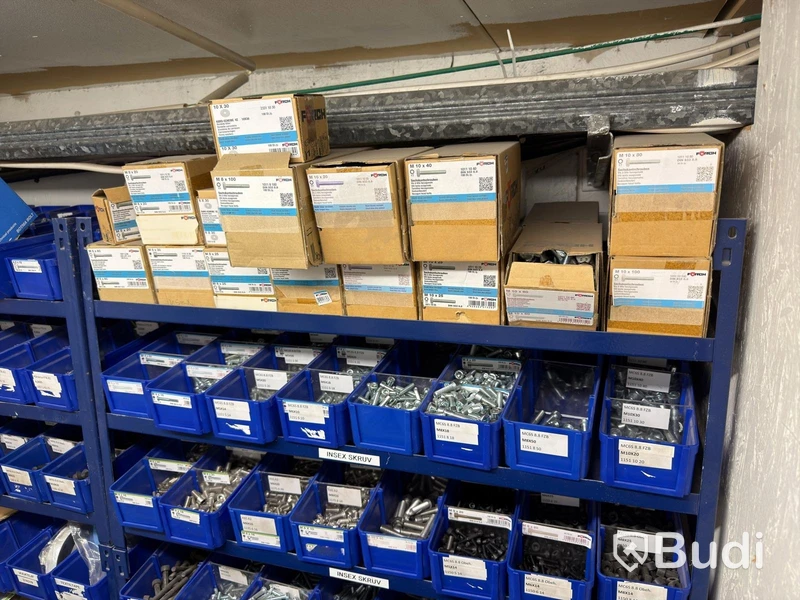 Storage shelving units with a large quantity of assorted bolts, nuts, etc.