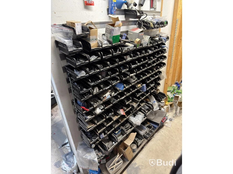 Storage shelving units with a large quantity of assorted bolts, nuts, etc.