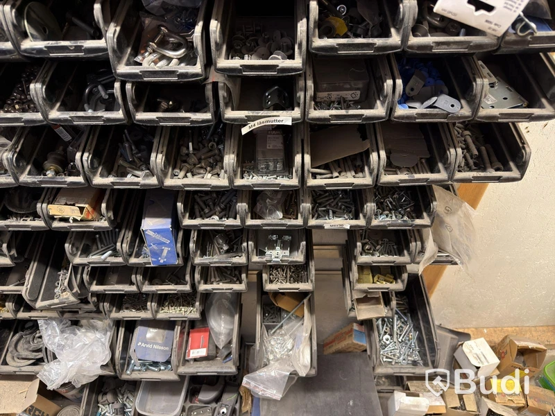 Storage shelving units with a large quantity of assorted bolts, nuts, etc.