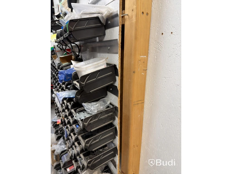 Storage shelving units with a large quantity of assorted bolts, nuts, etc.