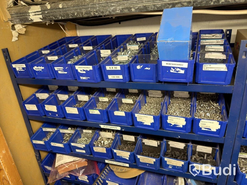 Storage shelving units with a large quantity of assorted bolts, nuts, etc.