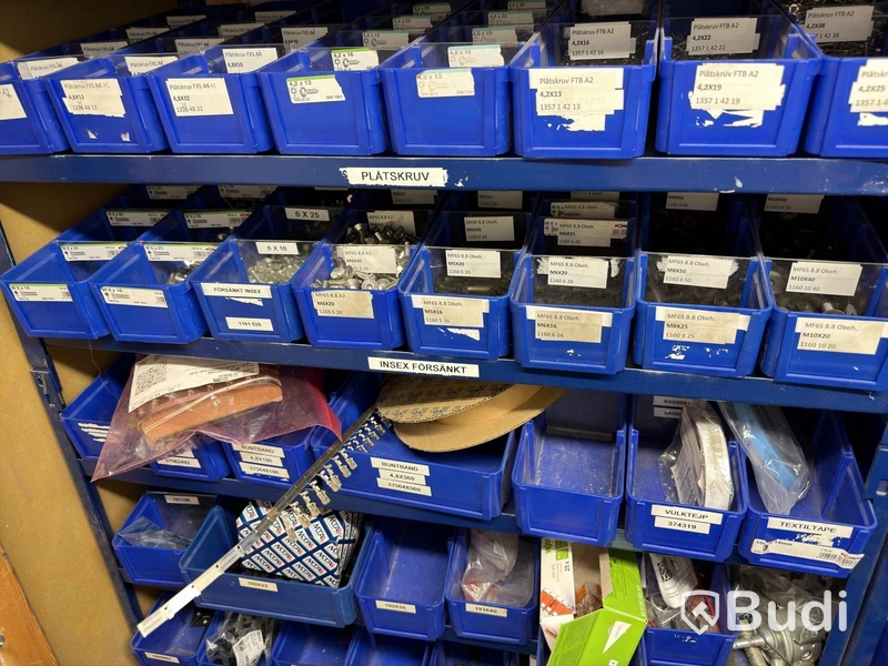 Storage shelving units with a large quantity of assorted bolts, nuts, etc.