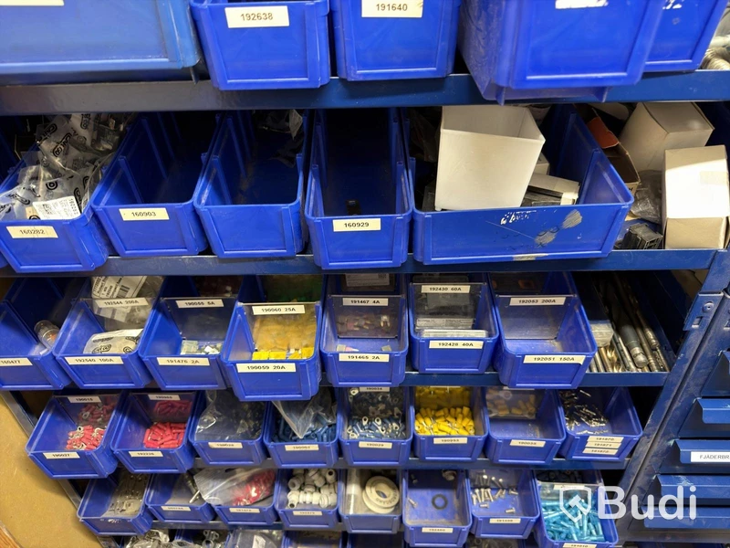 Storage shelving units with a large quantity of assorted bolts, nuts, etc.