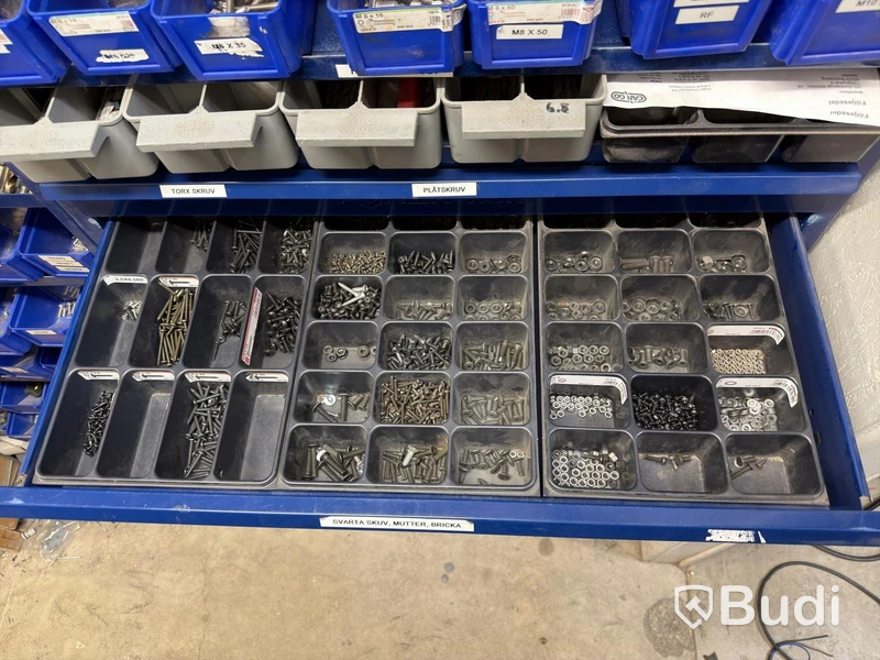 Storage shelving units with a large quantity of assorted bolts, nuts, etc.