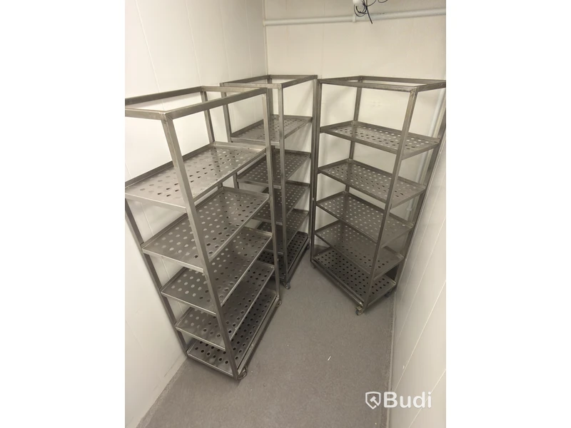 3 stainless steel shelving units on wheels