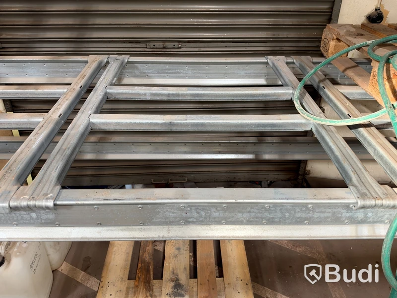 3 sections of pallet racking with pallet supports