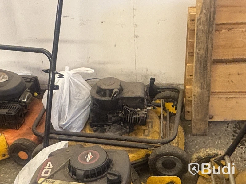Four petrol-powered lawn mowers. Sold as repair items.