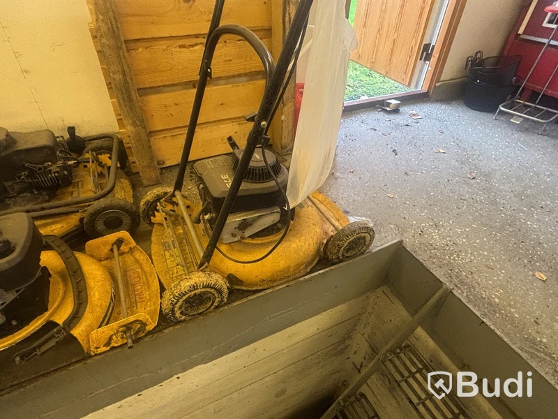 Four petrol-powered lawn mowers. Sold as repair items.