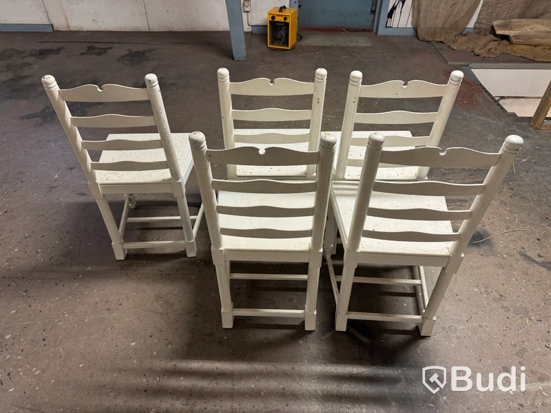 Five white-painted spindle-back chairs