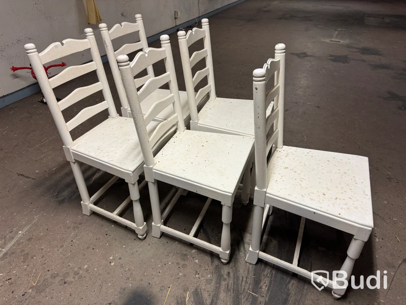 Five white-painted spindle-back chairs