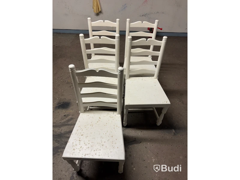 Five white-painted spindle-back chairs