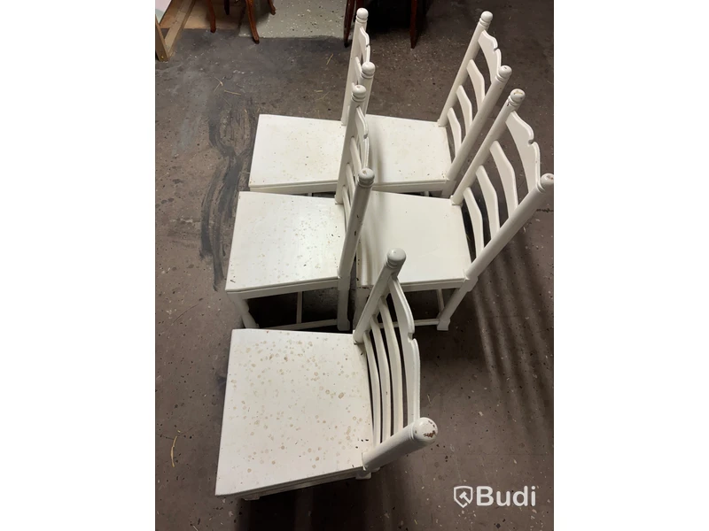 Five white-painted spindle-back chairs