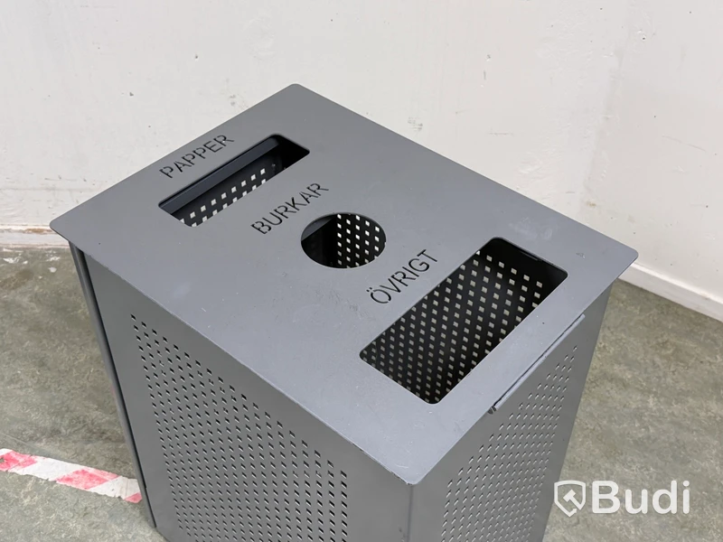 Recycling bin with three compartments for paper, cans and other waste