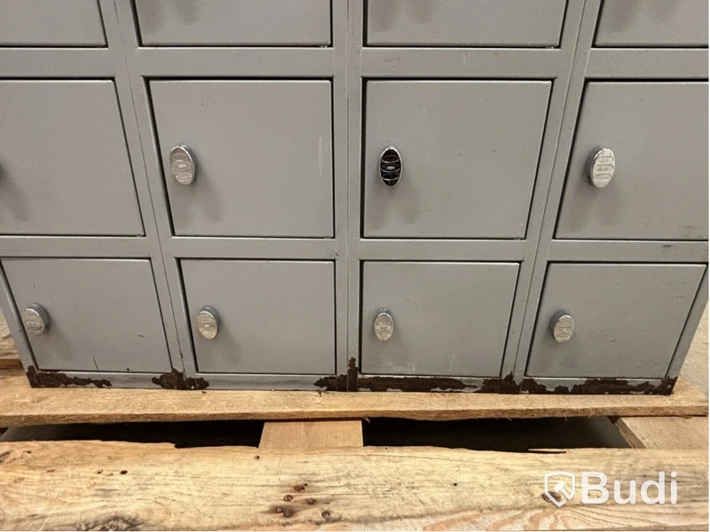 Metal security cabinet with 32 small compartments