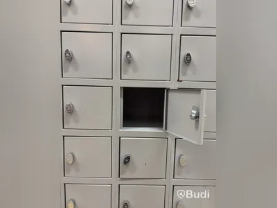 Metal security cabinet with 32 small compartments