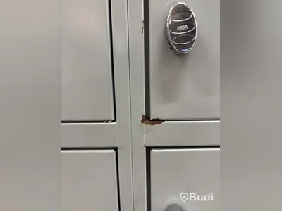 Metal security cabinet with 32 small compartments