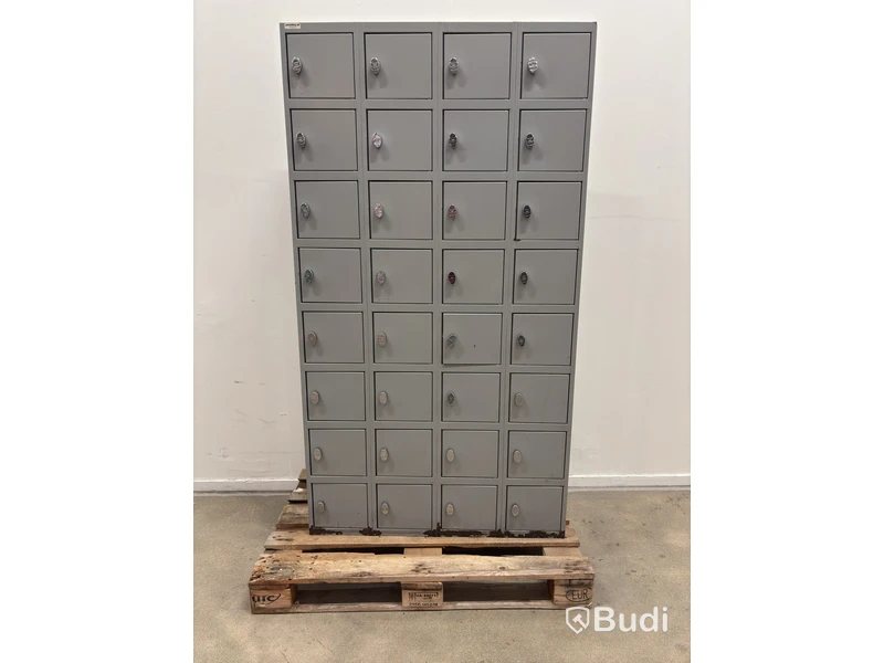 Metal security cabinet with 32 small compartments