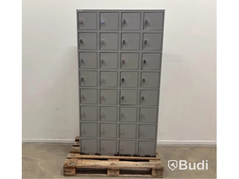 Metal security cabinet with 32 small compartments