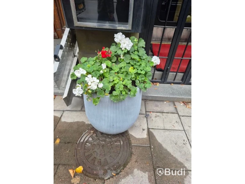 2 light blue planters with ribbed surface