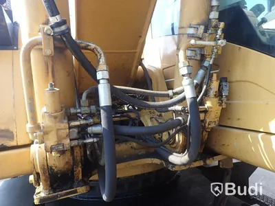 Caterpillar M322c Materialhanterare