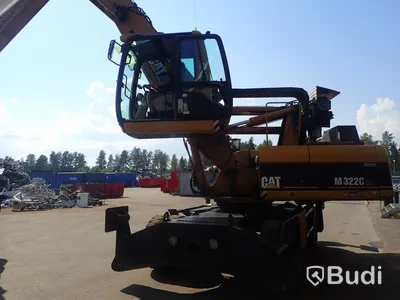 Caterpillar M322c Materialhanterare
