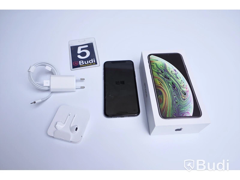 Iphone XS 64 GB med sprucken baksida, i kartong med laddare och headset
