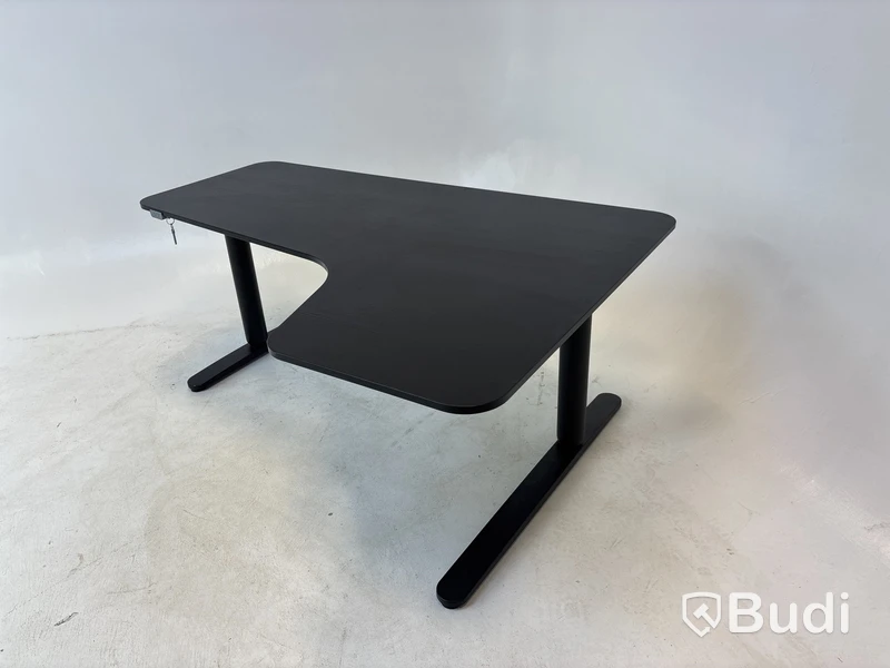 Höj- och sänkbart hörnskrivbord Ikea, Bekant