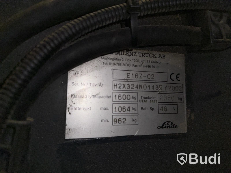 Truck Linde E16Z-02 med laddare och förlängningsgafflar