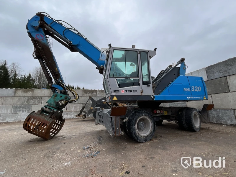 Materialhanterare med Grip Fuchs MHL 320 -2015  | Höj- och sänkbar hytt