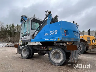 Materialhanterare med Grip Fuchs MHL 320 -2015  | Höj- och sänkbar hytt