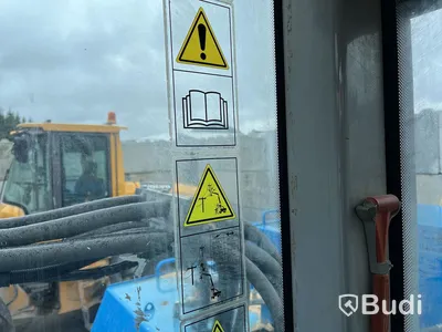 Materialhanterare med Grip Fuchs MHL 320 -2015  | Höj- och sänkbar hytt