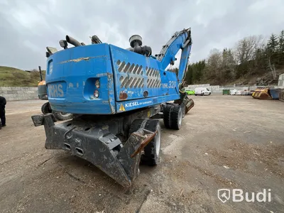 Materialhanterare med Grip Fuchs MHL 320 -2015  | Höj- och sänkbar hytt