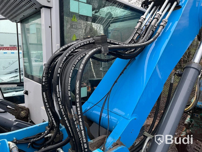 Materialhanterare med Grip Fuchs MHL 320 -2015  | Höj- och sänkbar hytt