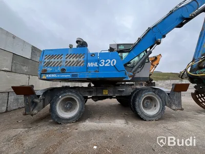 Materialhanterare med Grip Fuchs MHL 320 -2015  | Höj- och sänkbar hytt