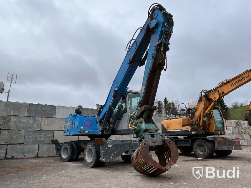 Materialhanterare med Grip Fuchs MHL 320 -2015  | Höj- och sänkbar hytt