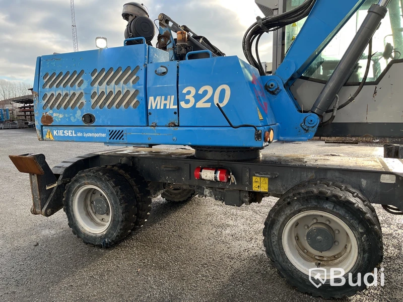 Materialhanterare Fuchs MHL 320 -2015 | Grip | Höj- och sänkbar hytt