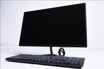 Datorskärm Voxicon D24FO med tangentbord och HDMI kabel.
