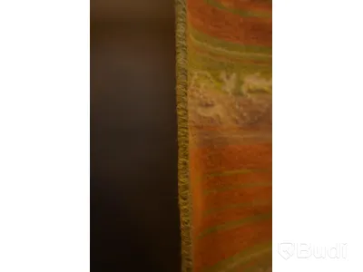 Handknuten matta i en härlig färgkombination av grön, orange, beige och detaljer i vitt, ca 59 x 110 cm