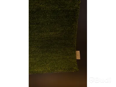 Handvävd matta i 100% ull, 80 x 160 cm. Denna matta med namnet Nepali har en mogen grön färg.