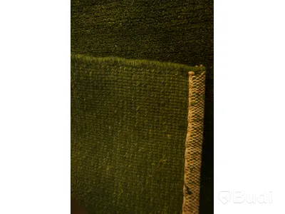 Handvävd matta i 100% ull, 80 x 160 cm. Denna matta med namnet Nepali har en mogen grön färg.